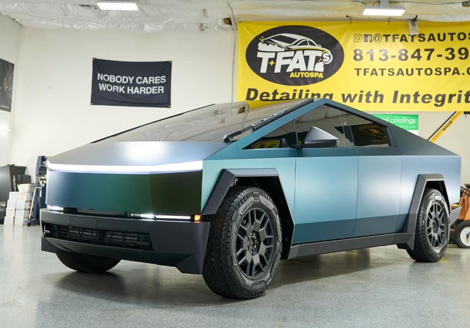 Tesla Cybertruck wrapped in vibrant green and gold colored paint protection film (PPF).