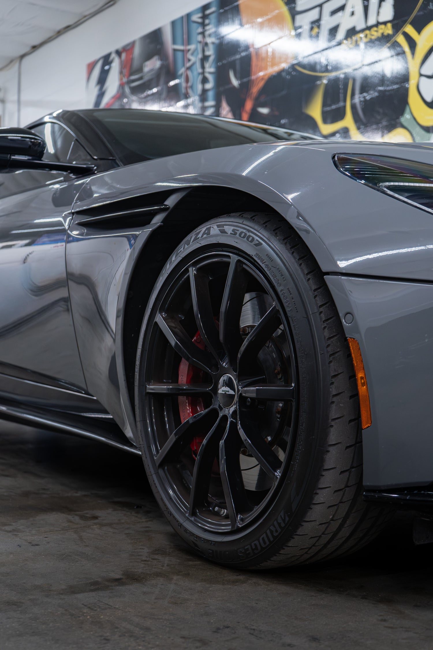 Close-up of a gray sports car after ceramic coating in Tampa