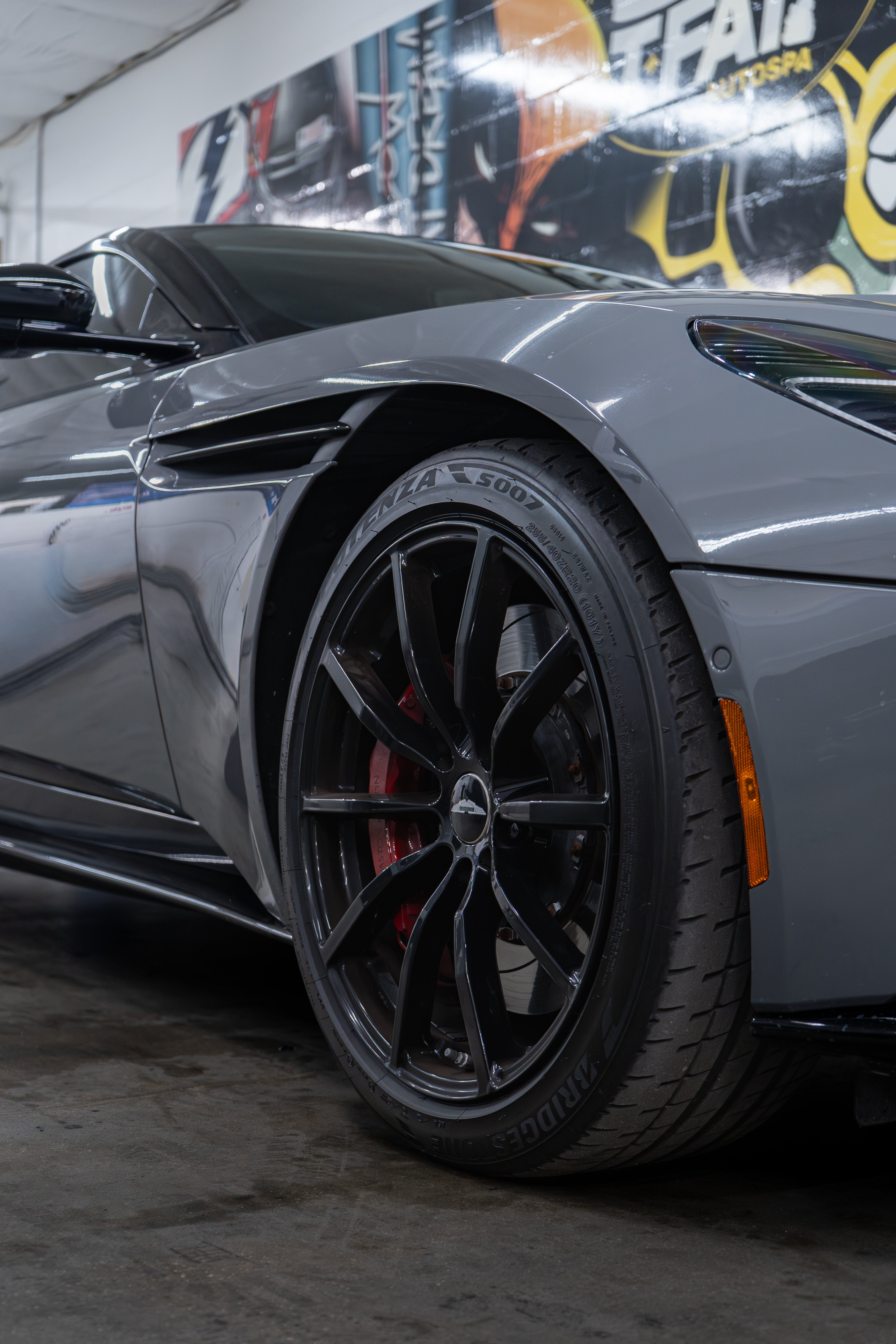 Close-up of a gray sports car after ceramic coating in Tampa