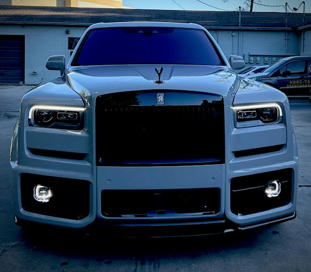 A luxury car with ceramic tinted windows after detailing