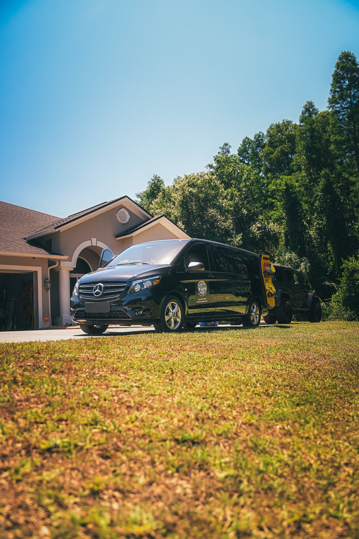 Black mobile detailing van parked in Tampa, Florida.